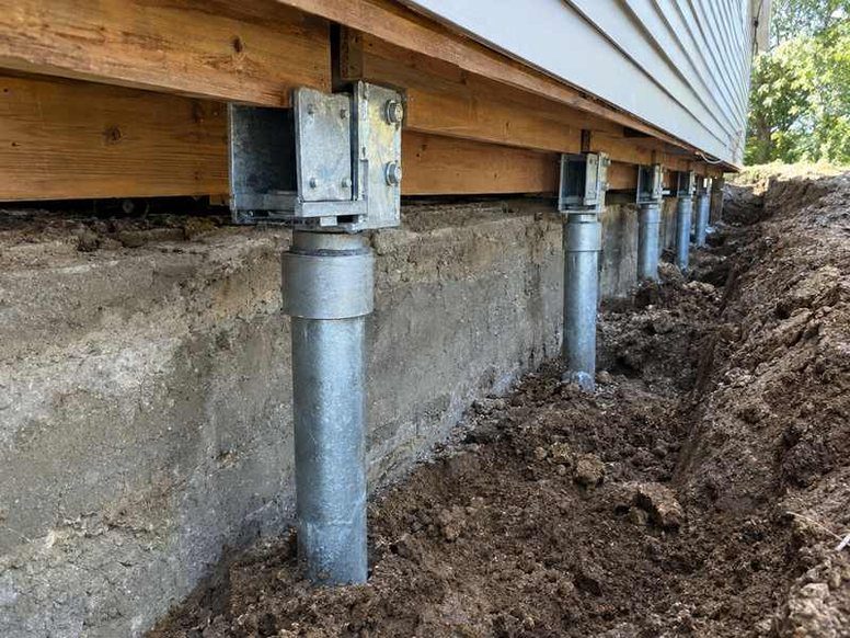 Settling foundation stabilized with piers at an Asheville home